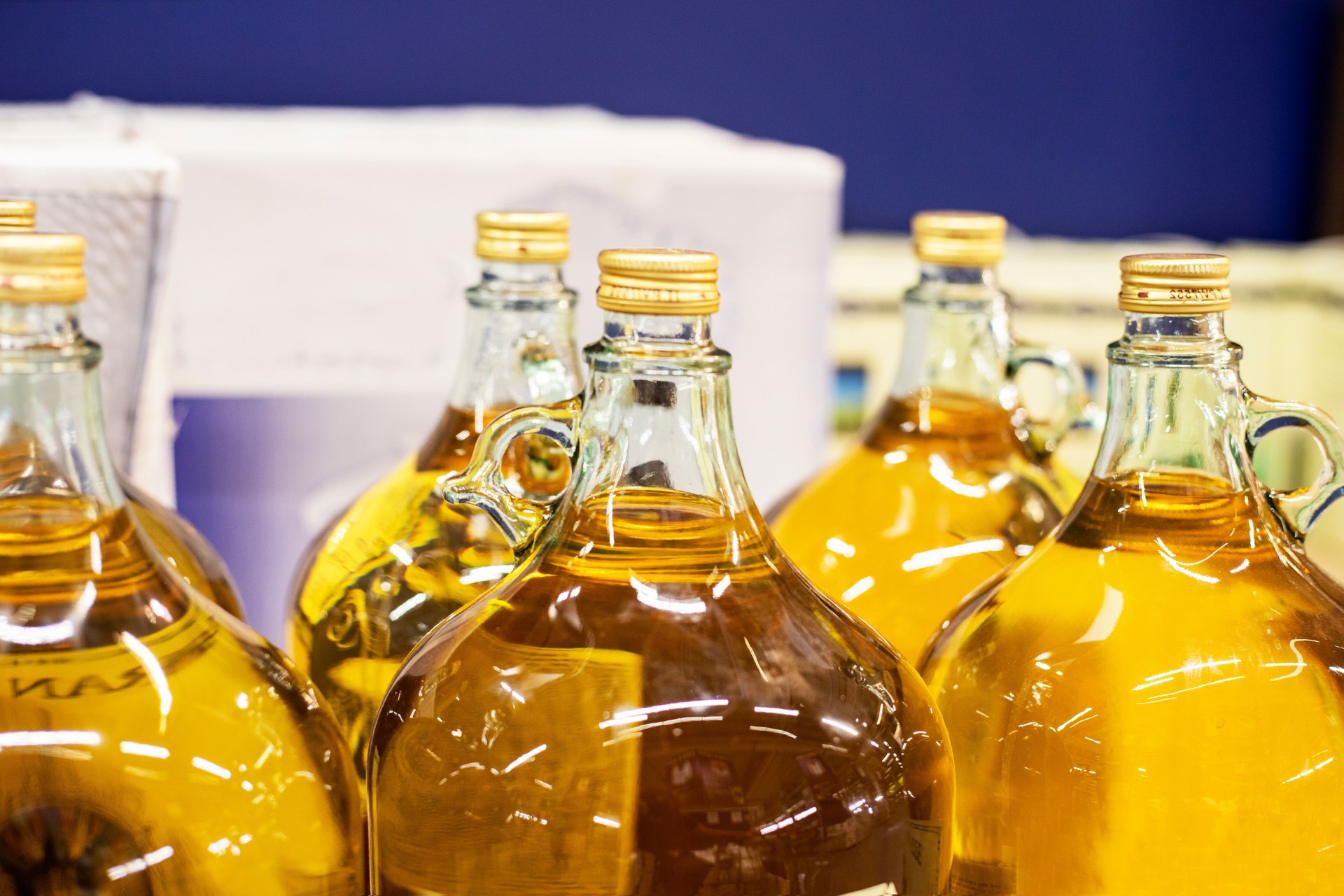 olive oil packaged in glass bottles in a supermarket. Beauty and health care